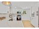 Modern kitchen with quartz countertops, stainless steel appliances, and stylish fixtures at 7826 Joan Dr, Denver, CO 80221
