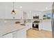 Kitchen featuring quartz countertops and stainless appliances at 7826 Joan Dr, Denver, CO 80221