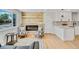 Cozy living area featuring a unique wood accent wall with a fireplace at 7826 Joan Dr, Denver, CO 80221
