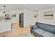 Open concept kitchen and living room featuring stainless steel appliances and hardwood floors at 7826 Joan Dr, Denver, CO 80221