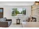 Living room view showcasing the bright interiors and a view of the neighborhood at 7826 Joan Dr, Denver, CO 80221