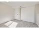 Finished basement featuring neutral walls, carpeted floors and a white closet at 15510 E Bates Ave, Aurora, CO 80013