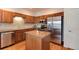 Kitchen with stainless steel appliances and an island at 8512 S Lewis Way, Littleton, CO 80127