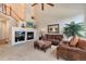 Living room with fireplace and a view of the staircase at 8512 S Lewis Way, Littleton, CO 80127