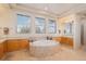 Beautiful bathroom with a large round tub, lots of cabinet space, and plenty of natural light at 24273 E Fremont Dr, Aurora, CO 80016