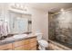 Bathroom with granite counters, vanity, a glass enclosed walk-in shower at 24273 E Fremont Dr, Aurora, CO 80016