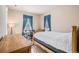 Bright bedroom with a comfortable bed, large dresser and an office space with bright natural light at 24273 E Fremont Dr, Aurora, CO 80016