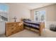 Cozy bedroom featuring a wood bed frame, wooden dresser, and bright natural light at 24273 E Fremont Dr, Aurora, CO 80016