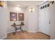 Bright and airy foyer with hardwood floors, decorative lighting, and elegant decor at 24273 E Fremont Dr, Aurora, CO 80016