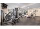 Well-equipped gym with mirrored wall, weight machines, and rubber flooring at 24273 E Fremont Dr, Aurora, CO 80016