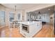 Open kitchen with stainless steel microwave in the island and eat in dining room at 24273 E Fremont Dr, Aurora, CO 80016