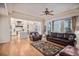 Spacious living area with hardwood floors and view into the kitchen at 24273 E Fremont Dr, Aurora, CO 80016