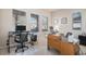 Well-lit office space with multiple desk configurations, perfect for working from home at 24273 E Fremont Dr, Aurora, CO 80016