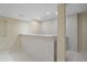 Basement mini-bar area featuring marble counters and backsplash, complementing the light hardwood floors at 6393 S Richfield St, Aurora, CO 80016