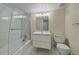 Bathroom showcasing a modern vanity, sleek glass shower, and neutral-toned walls and flooring at 6393 S Richfield St, Aurora, CO 80016