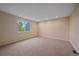 Bedroom with a large window, recessed lighting, carpeted flooring, and neutral walls at 6393 S Richfield St, Aurora, CO 80016