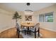 Cozy dining room with hardwood floors and a modern chandelier at 6393 S Richfield St, Aurora, CO 80016
