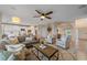 Spacious living room with open layout to the kitchen and dining areas at 6393 S Richfield St, Aurora, CO 80016