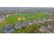 Aerial view of the neighborhood with a large park and baseball field for recreational activities at 6393 S Richfield St, Aurora, CO 80016