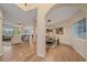 Open floor plan with archways connecting the living and dining areas at 6393 S Richfield St, Aurora, CO 80016