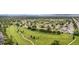Scenic aerial view of the townhome community next to a golf course with walking path at 8738 Chase Dr # 133, Arvada, CO 80003