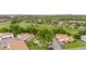 An aerial view of townhomes with a view of the community green space and nearby city at 8738 Chase Dr # 133, Arvada, CO 80003