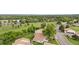 An aerial view shows the townhomes and the expansive community green space and walkways at 8738 Chase Dr # 133, Arvada, CO 80003