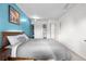 This bedroom features a large bed, a closet, and great natural light at 8738 Chase Dr # 133, Arvada, CO 80003