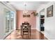 Bright dining area with sliding glass doors, chandelier, and convenient access to the kitchen at 8738 Chase Dr # 133, Arvada, CO 80003