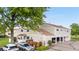 Charming townhome with attached garages and lush green trees providing ample shade at 8738 Chase Dr # 133, Arvada, CO 80003
