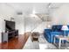 Cozy living room with hardwood floors, staircase, and neutral wall paint at 8738 Chase Dr # 133, Arvada, CO 80003