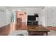 Open-concept living room featuring stylish furnishings and hardwood floors, connecting to the dining area at 8738 Chase Dr # 133, Arvada, CO 80003