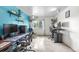 A large home office with several desks and a window providing natural light at 8738 Chase Dr # 133, Arvada, CO 80003