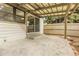 The back patio features a covered area, concrete floor, and a sliding glass door leading to the interior at 7900 W Layton Ave # 864, Littleton, CO 80123