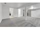Open basement area showing carpet, multiple doorways, and stairs at 7900 W Layton Ave # 864, Littleton, CO 80123