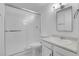 Bathroom featuring a shower with glass doors, a sink with white cabinets, and a toilet at 7900 W Layton Ave # 864, Littleton, CO 80123
