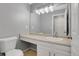 Well-lit bathroom with large mirror and white vanity at 7900 W Layton Ave # 864, Littleton, CO 80123