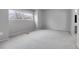 A gray bedroom with a window and carpet at 7900 W Layton Ave # 864, Littleton, CO 80123