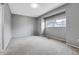 A gray bedroom with a window at 7900 W Layton Ave # 864, Littleton, CO 80123