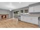 Open-concept kitchen with stainless steel appliances and view to living room with fireplace at 7900 W Layton Ave # 864, Littleton, CO 80123