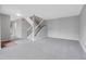 Open living room with updated gray walls and a staircase at 7900 W Layton Ave # 864, Littleton, CO 80123