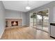 Cozy living room with a brick fireplace and hardwood floors at 7900 W Layton Ave # 864, Littleton, CO 80123