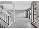 Bright living room with neutral carpet, fresh paint, and staircase at 7900 W Layton Ave # 864, Littleton, CO 80123
