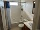 Functional bathroom with a shower-tub combo and updated fixtures at 4505 Everett St, Wheat Ridge, CO 80033