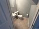Cozy bathroom features a pedestal sink and neutral tiled floors at 4505 Everett St, Wheat Ridge, CO 80033