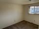 Neutral bedroom features a large window offering natural light at 4505 Everett St, Wheat Ridge, CO 80033