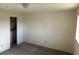 Bedroom with carpeting, closet, and neutral paint at 4505 Everett St, Wheat Ridge, CO 80033