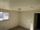 Cozy bedroom features a large window and neutral color paint at 4505 Everett St, Wheat Ridge, CO 80033