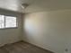 A clean bedroom provides natural lighting from the window and ample space at 4505 Everett St, Wheat Ridge, CO 80033