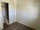 Bedroom with carpeting, closet, and neutral paint at 4505 Everett St, Wheat Ridge, CO 80033